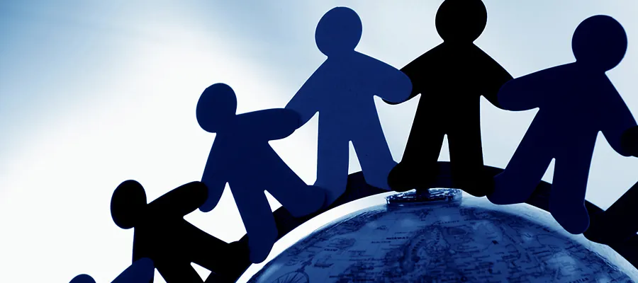 Paper dolls circling the globe