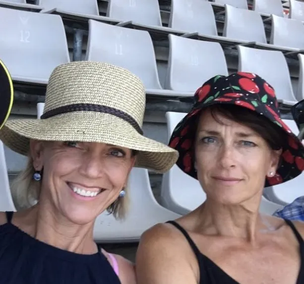 VIKING Volunteers Helga and Ingrid seated at a stadium