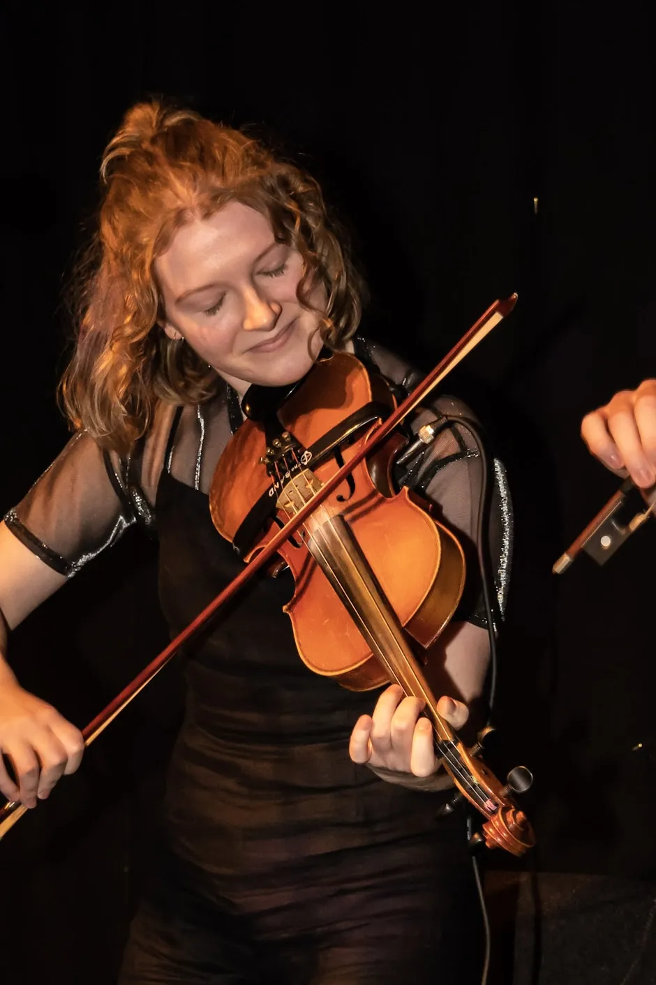 Kiera playing the fiddle