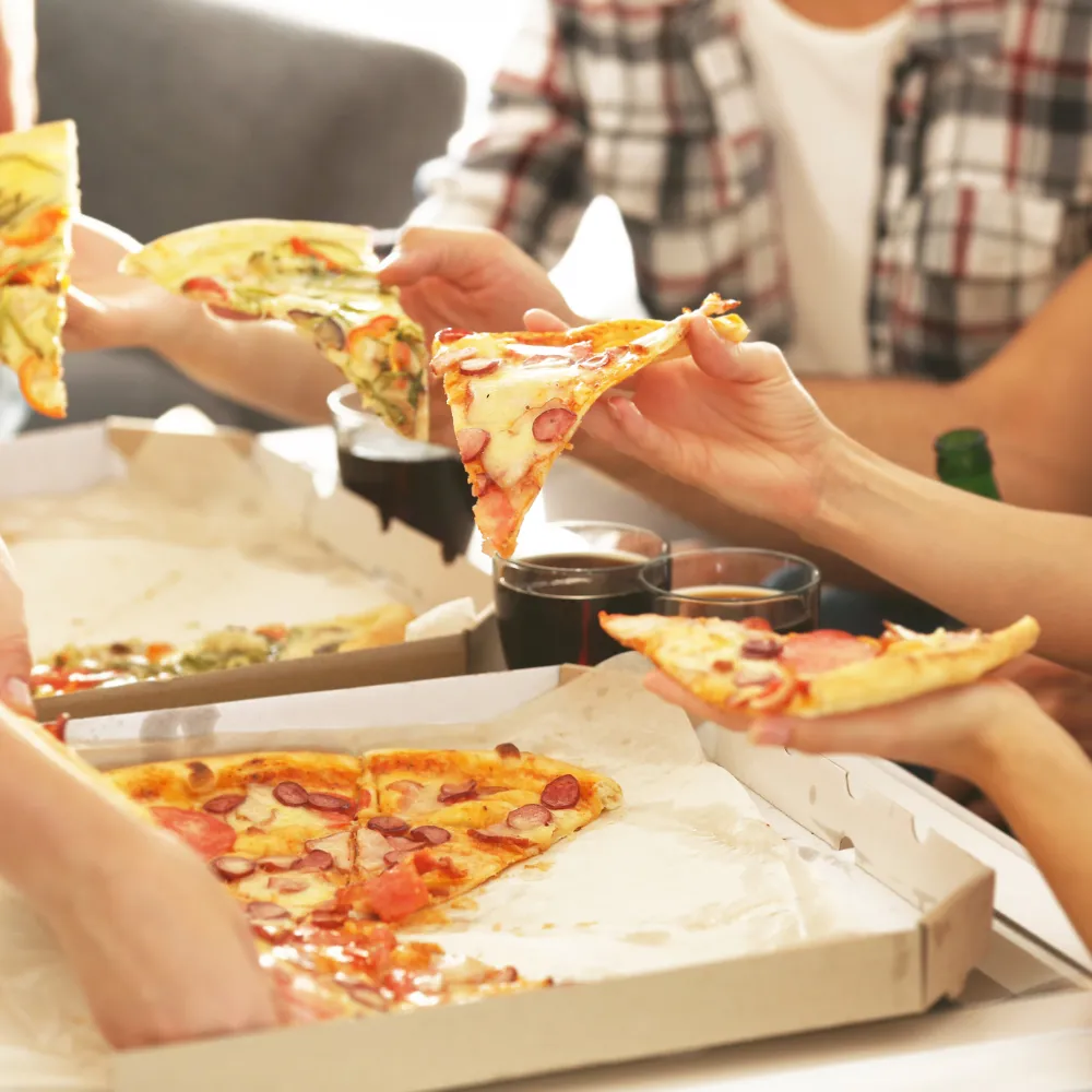 Friends eating pizza