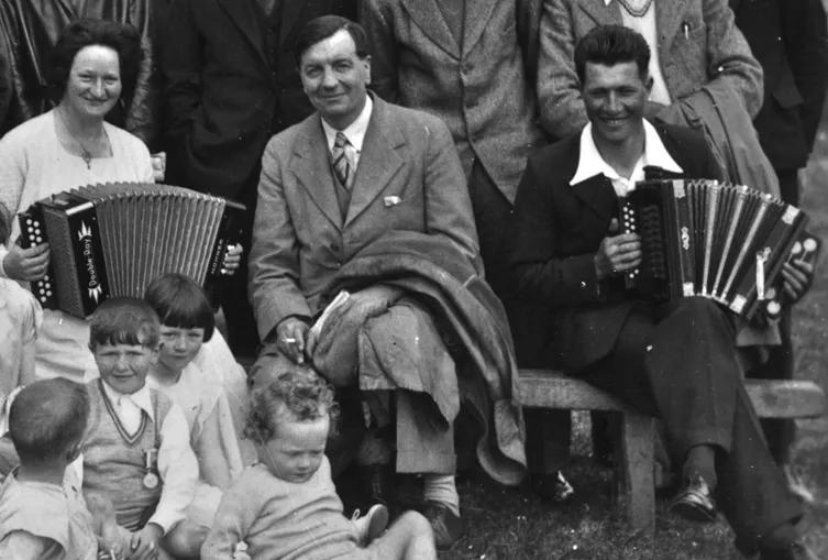 Hannah Stout and Jimmy Wilson playing the accordion, Fair Isle, Shetland - coronation day 1937 
