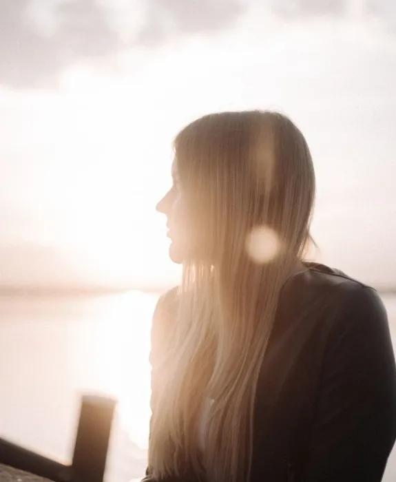 Girl in sunlit landscape 